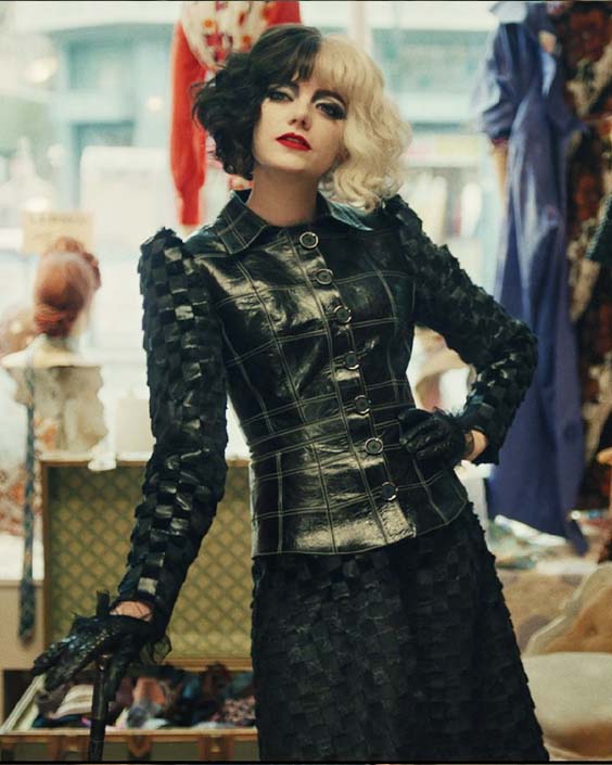 Cruella Estella in a leather suit with a skirt