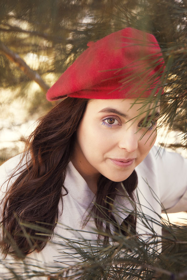 Beanie Feldstein in a red berret