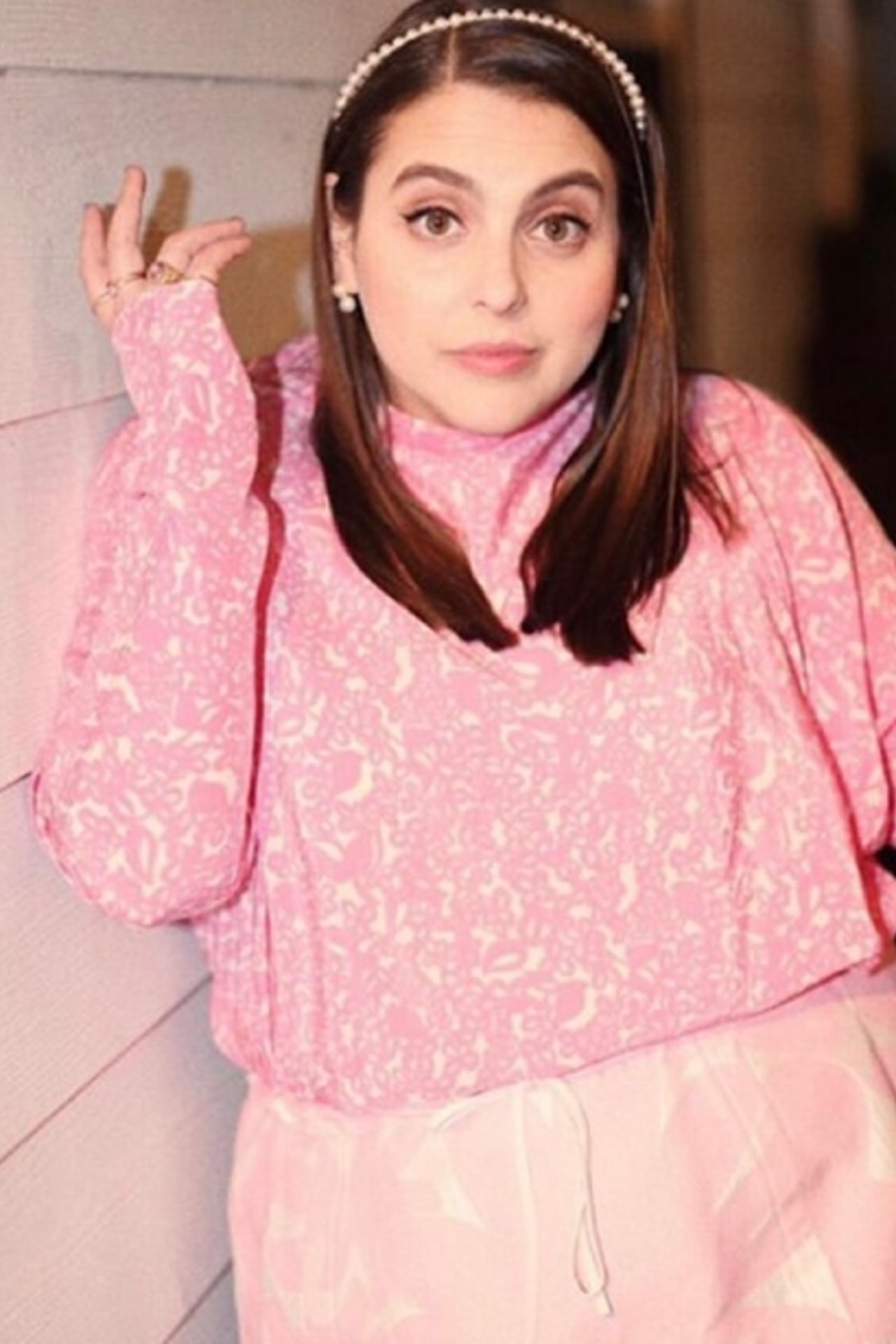 Beanie Feldstein in a pink outfit