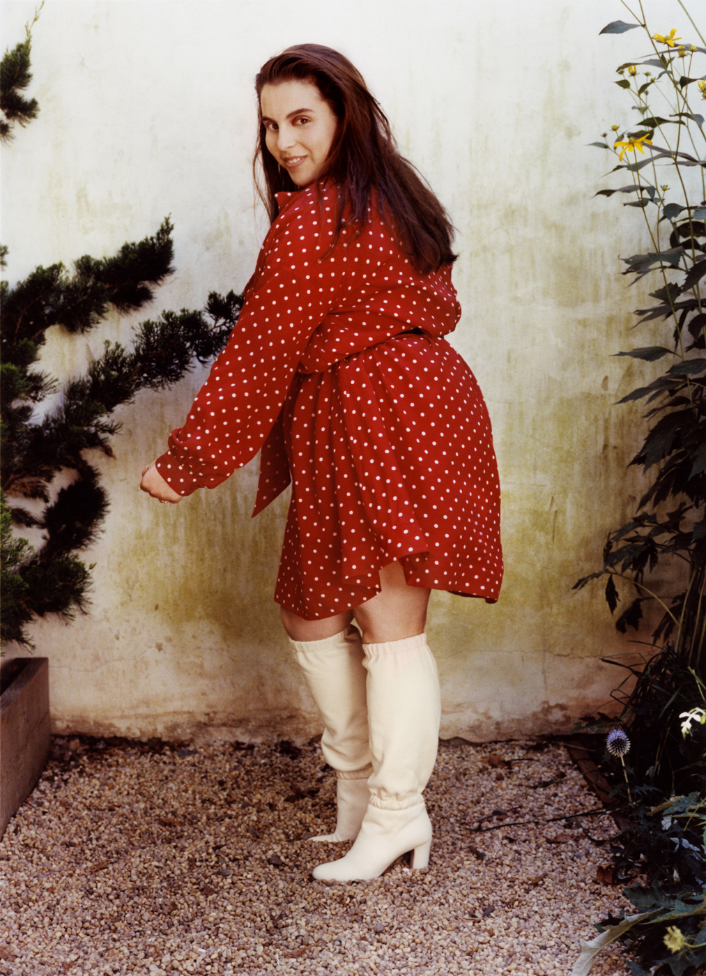 Beanie Feldstein in a red polka dress