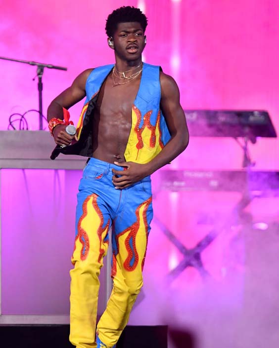 Lil nas x in a ves and yellow fire pants
