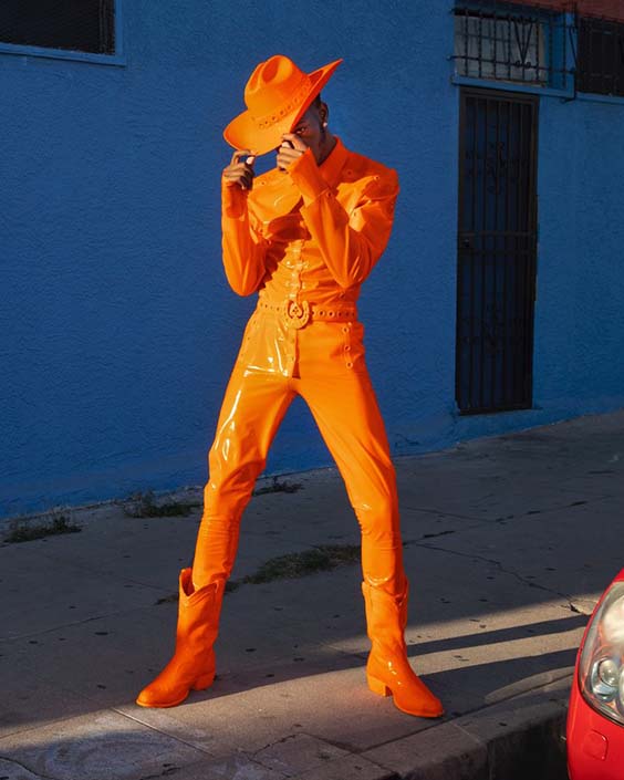 Lil Nas X in an orange suit