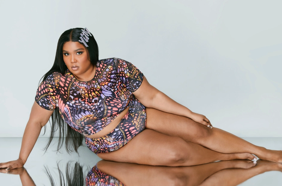 Lizzo wears cut-out leggings from new shapewear line to excitement