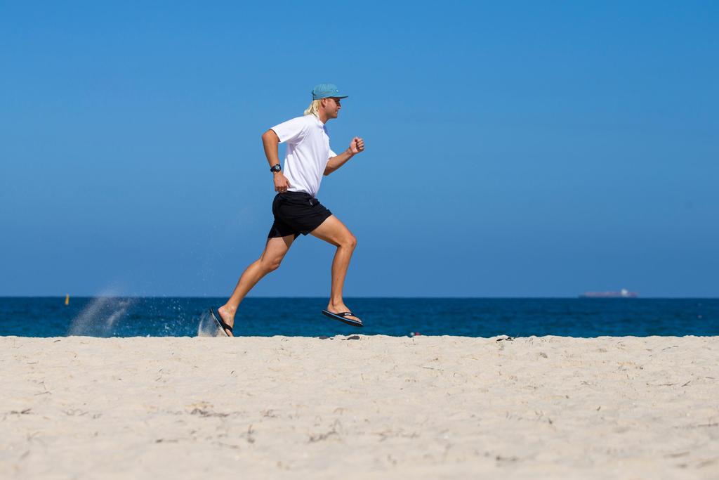 City Beach lifesaver Sam Hensen-Thompson in thongs in Perth running a marathon