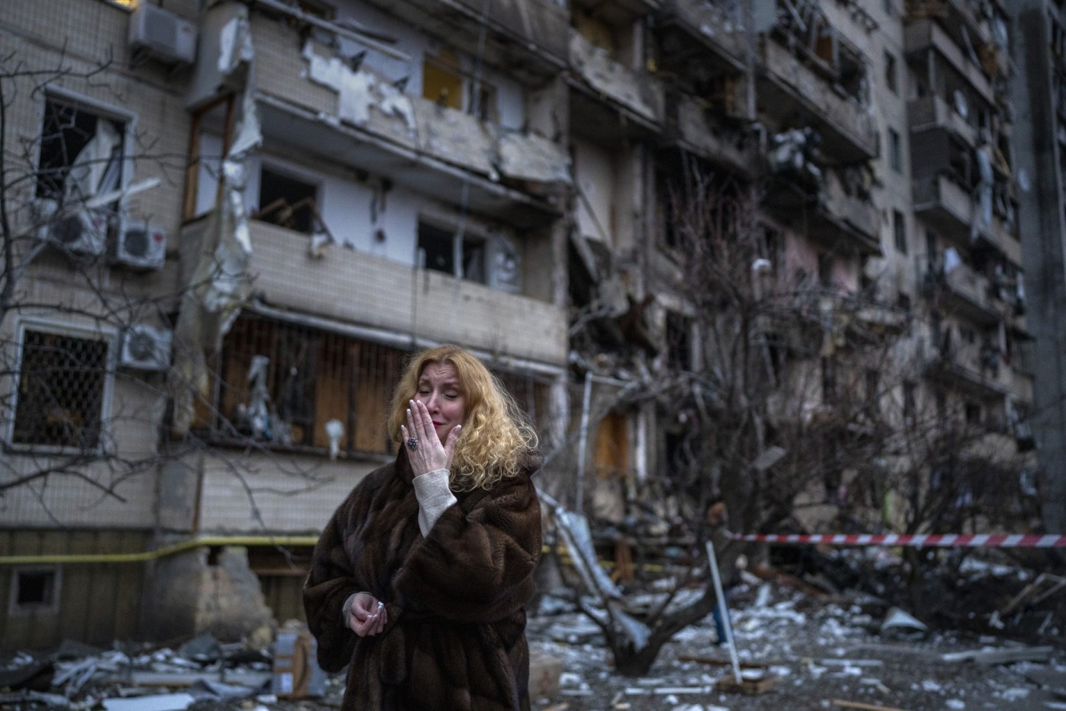  A Ukrainian woman reacts next to her house following a rocket attack in the city of Kyiv, Ukraine on Feb. 25, 2022.
                    AP

                    