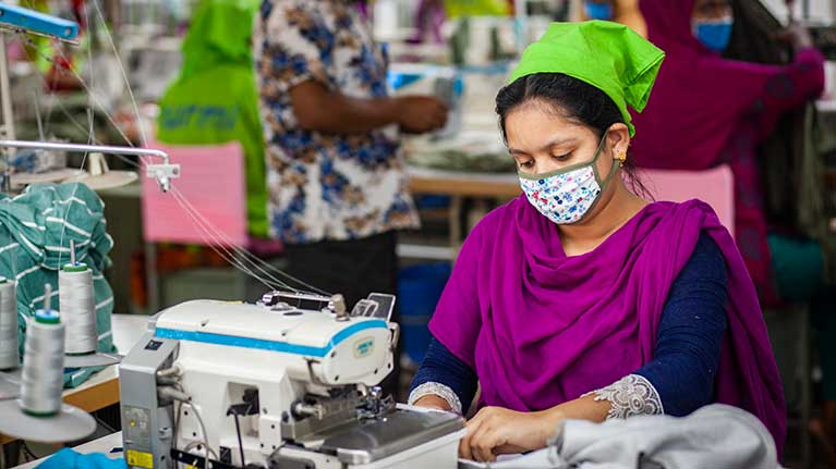 H&M Levi Strauss, Columbia Sporting Company, Asics, DKNY and Tommy Hilfiger face legal complaints, image of fashion workers in asia