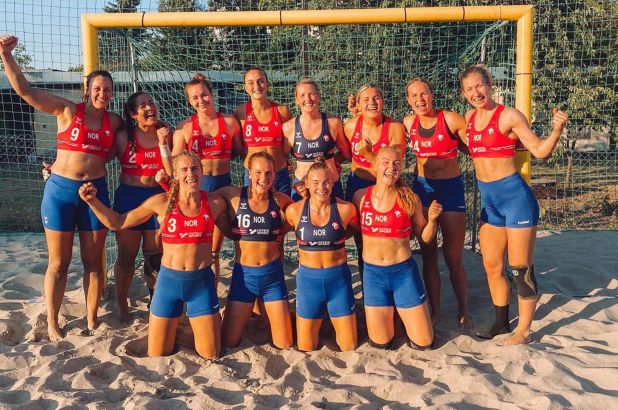 Norwegian beach handball team in a banned uniform, shorts