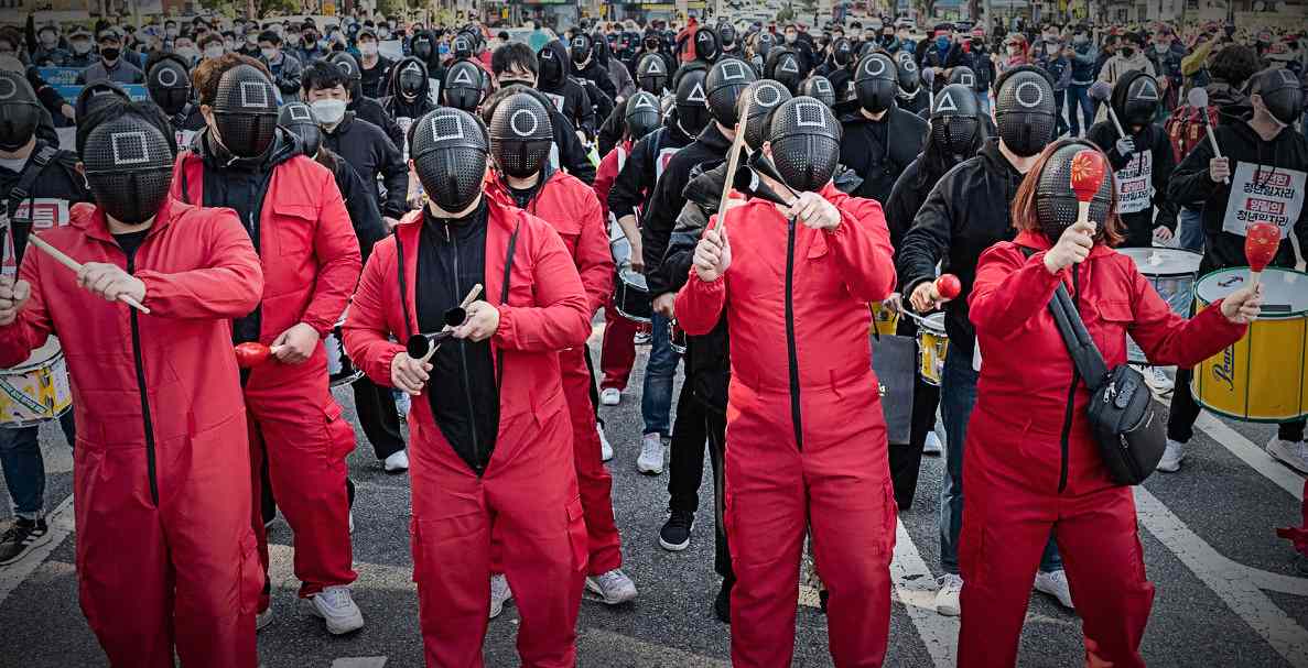 South Korean protestors wore ‘Squid Game’ masks to shine a light on poor working conditions in the country. Read the key points below.
                    