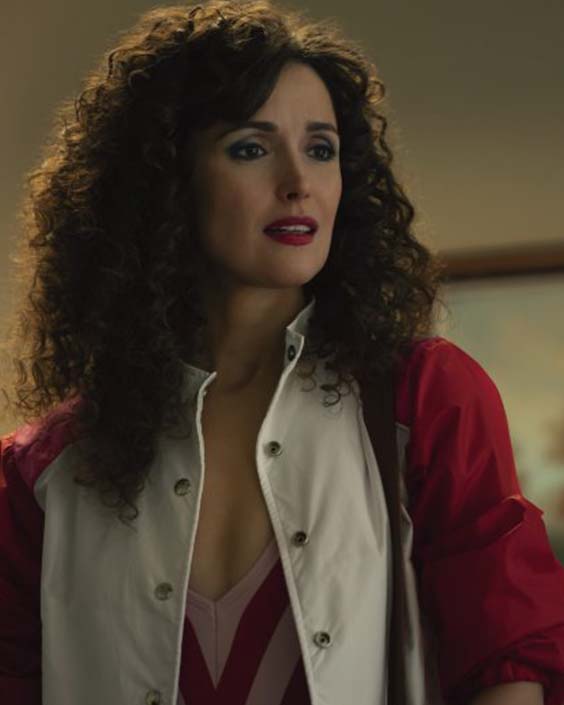 Apple TV’s show Physical starring Rose Byrne as Sheila Rubin wearing a pink and red bomber jacket