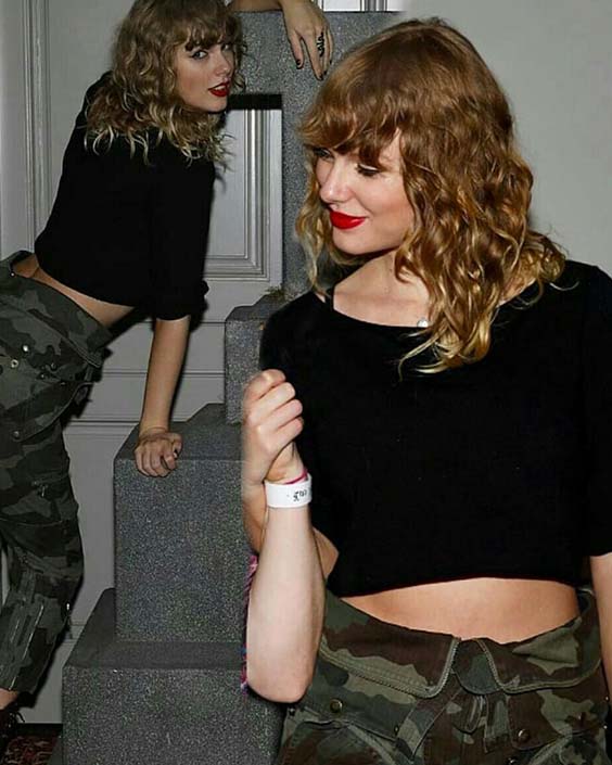 Taylor Swift in a black cropped top and pants secret session reputation